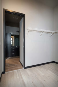 Wire shelving in the room-sized walk-in closets.