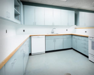 Custom design of countertops to fit existing cabinets and appliances at the Home Economics classroom at Coginchaug High School in Durham, CT