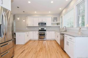 View of new cabinets and counters in the kitchen in a Madison property rehab by Lynne Thomas and Viking Kitchens.