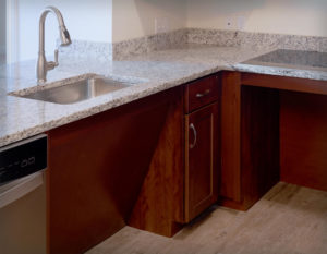 Custom ADA compliant cabinets for sink and range units at Regency Village, Merrimac, MA.