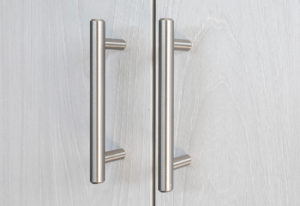 Detail of the 6" steel bar pulls on the kitchen cabinets at The Borden Luxury Apartments.