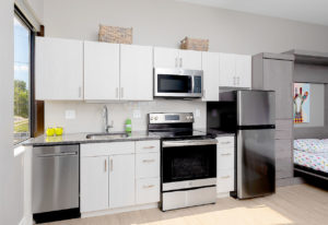 Studio kitchen cabinets and counters at The Borden Luxury Apartments.