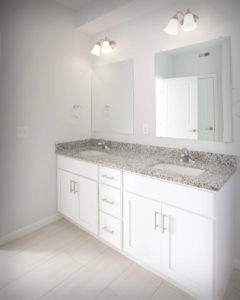 Viking Kitchens installed CNC Luxor vanity bases in White in the bathrooms at Residences On Main in Bristol.