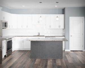 Residences On Main kitchen with CNC Luxor perimeter cabinets in White and Island in Smokey Grey.