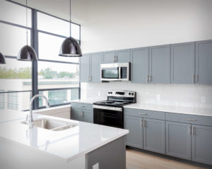 View of the kitchen islands and cabinets at the U-Shaped Apartments at Colt Gateway where Viking Kitchens has installed kitchens and bathrooms.