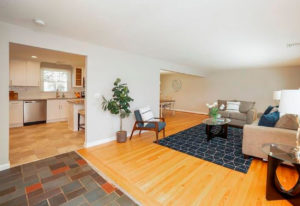 View from the living area of new cabinets and counters in the kitchen in a West Hartford property rehab by Oculus Construction.